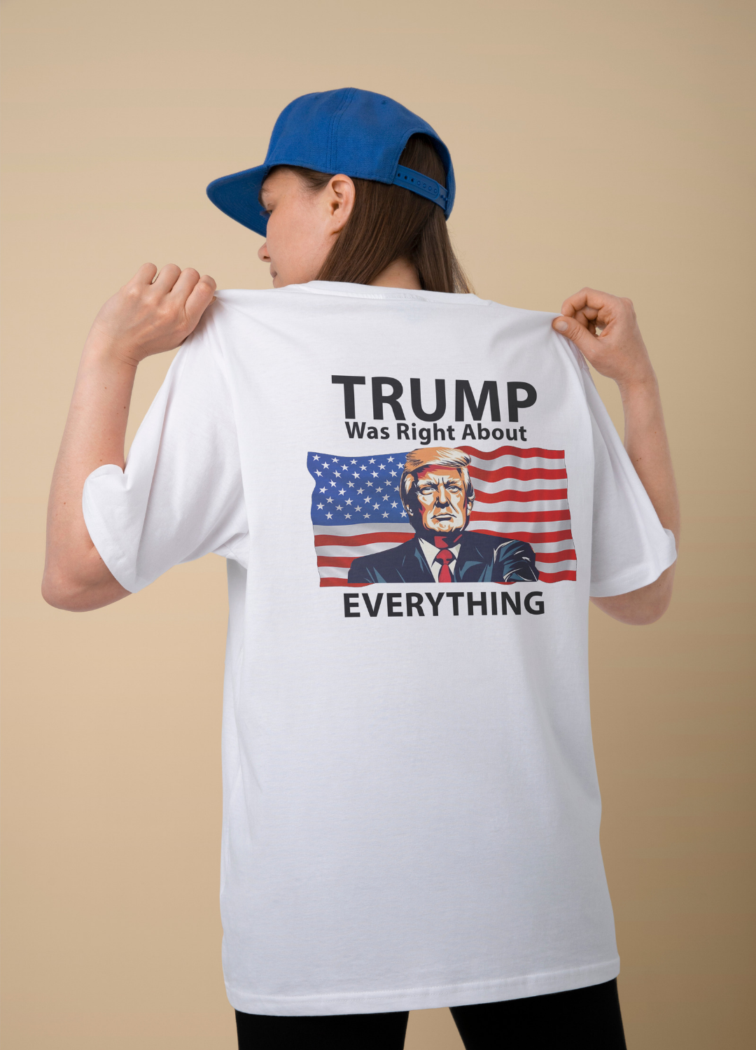 This captivating image showcases a woman confidently sporting a white shirt with a Trump-themed design on the back. The shirt features a picture of Donald Trump himself along with the powerful words "Trump was right about everything.". Get yours now! Support Trump this year.